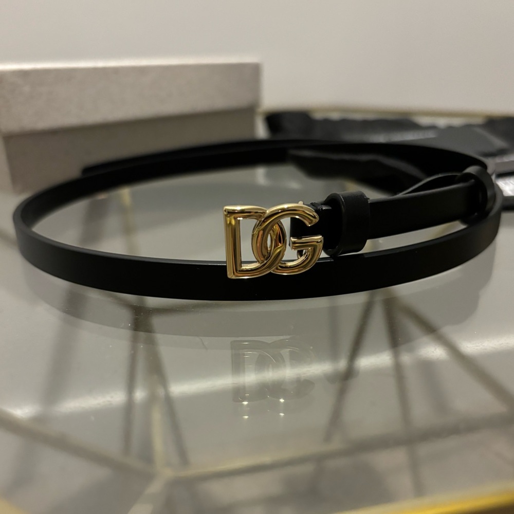 Dolce and Gabbana black calfskin belt with gold hardware.